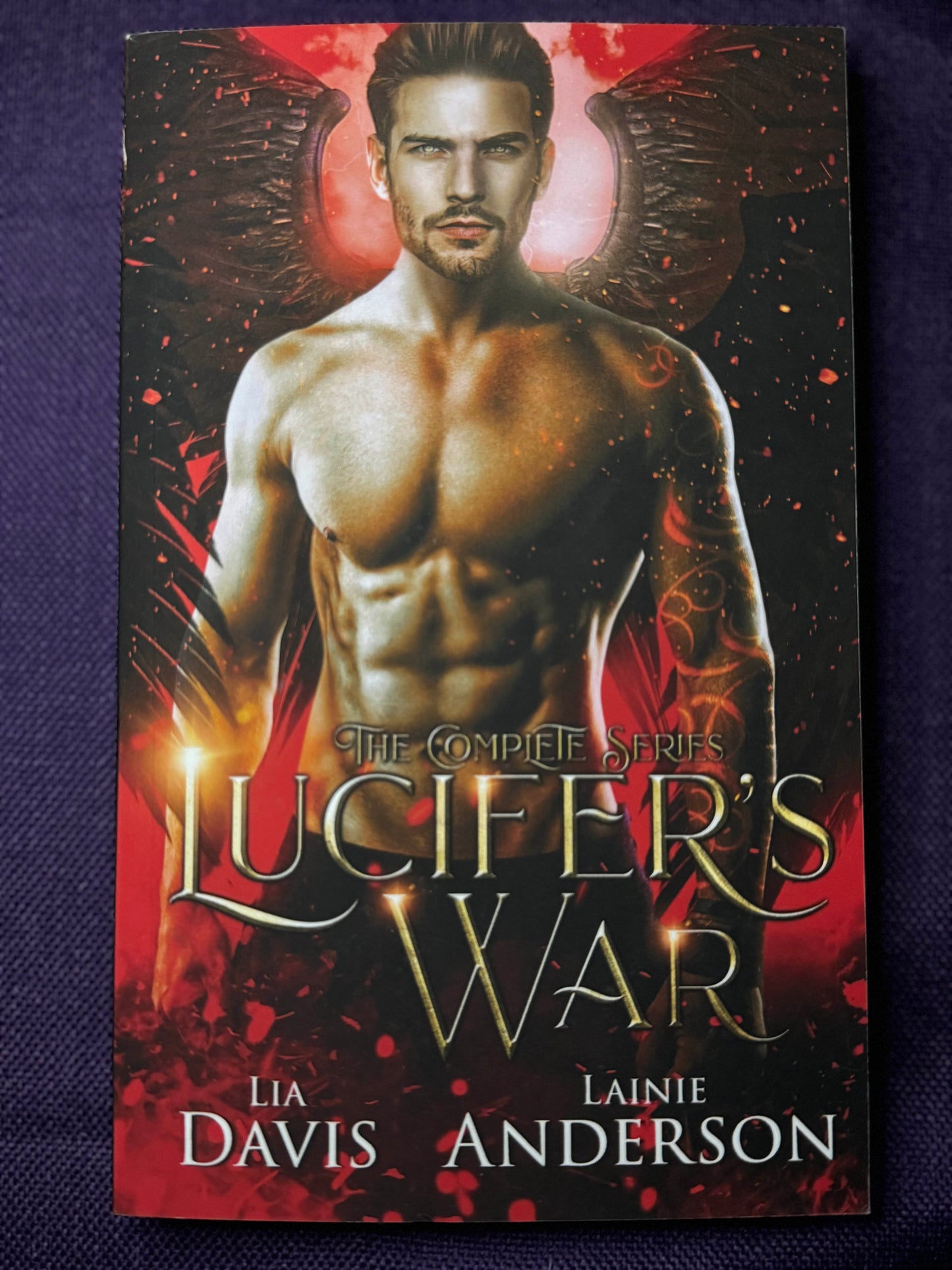 Lucifer's War The Complete Series Paperback Signed by Lainie Anderson with Lia Davis's digital signature and swag pack